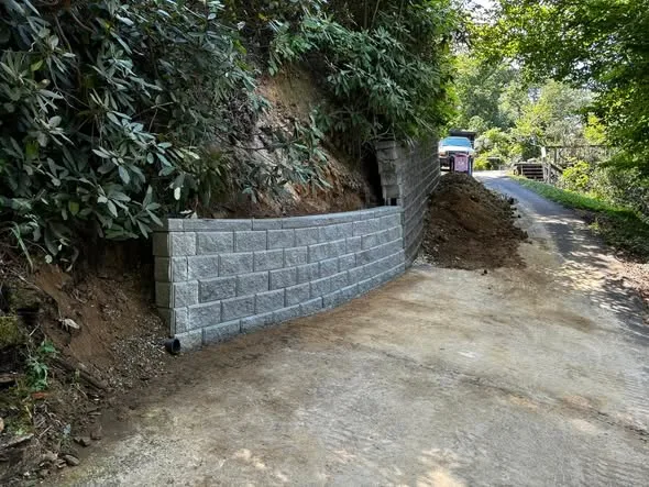 Finished block retaining wall along the driveway